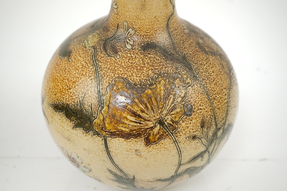 Robert Wallace Martin for Martin Brothers: A salt-glazed stoneware vase decorated with wild flowers